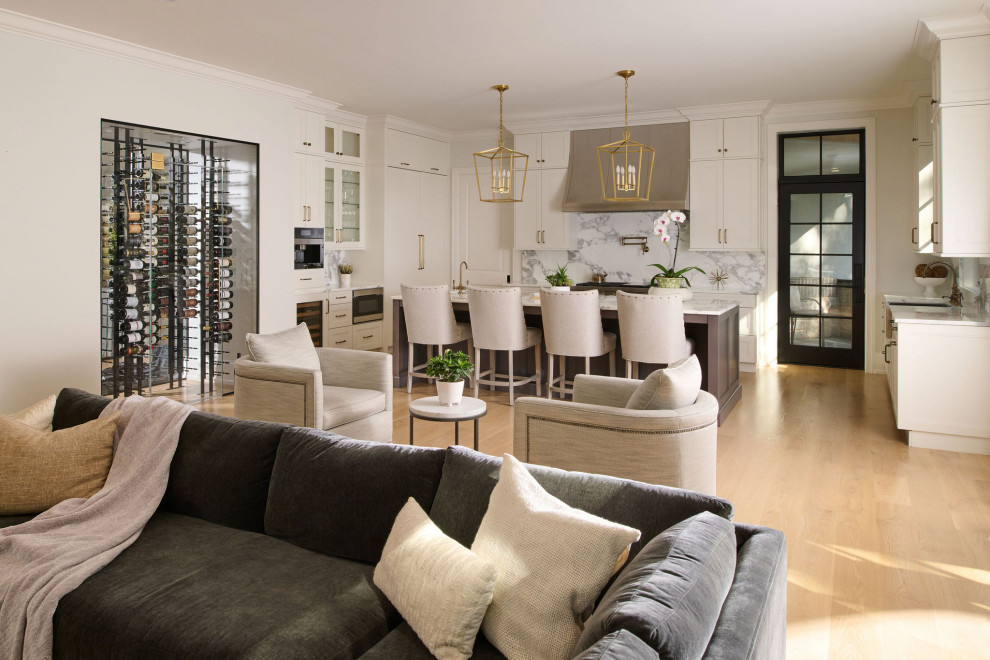 Open concept kitchen - large open concept kitchen idea in Chicago with shaker cabinets, paneled appliances and an island