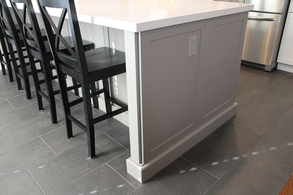 Example of a transitional kitchen design in Toronto