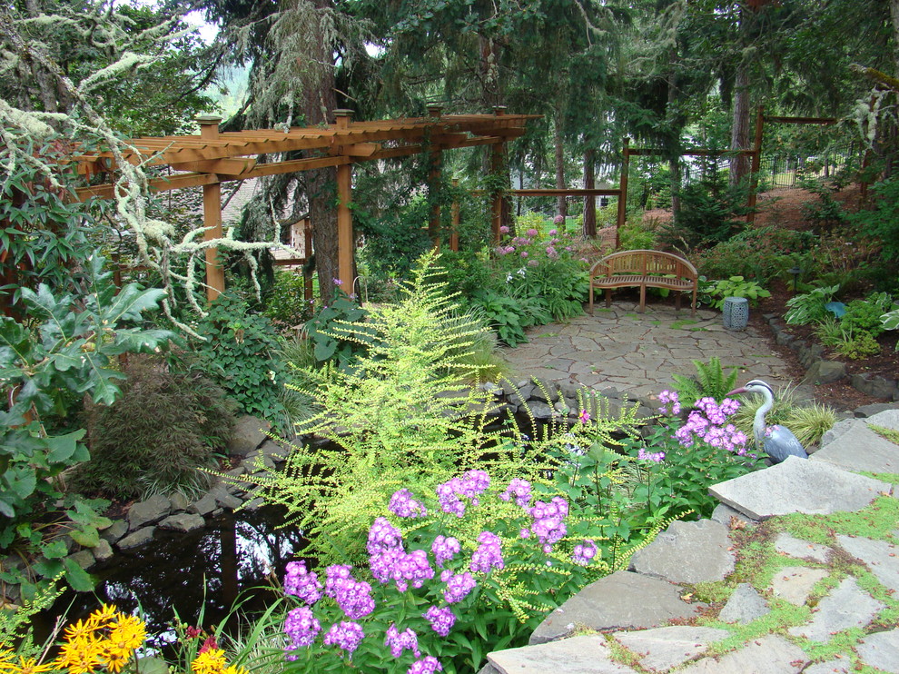 Traditional garden in Portland with a water feature.