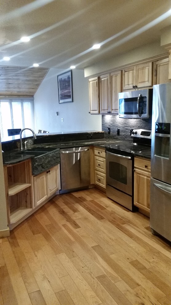 Example of a mountain style kitchen design in Denver