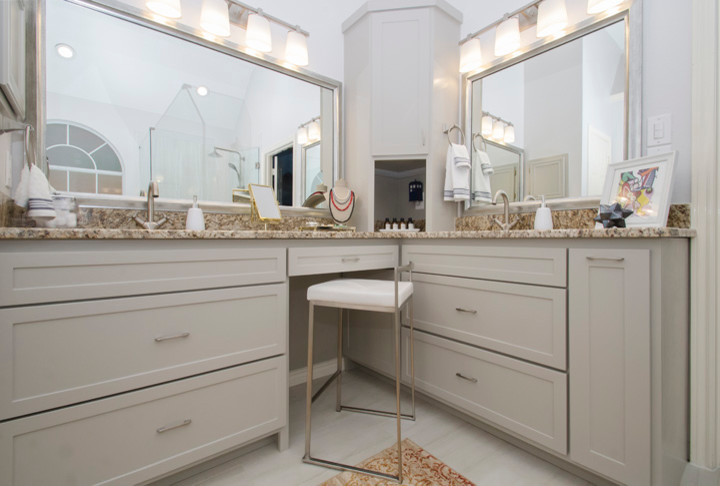 Example of a large transitional master beige tile and porcelain tile porcelain tile and beige floor freestanding bathtub design in Dallas with shaker cabinets, gray cabinets, a one-piece toilet, beige walls, an undermount sink, granite countertops and a hinged shower door
