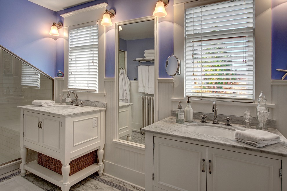 Bathroom - mid-sized traditional white tile and subway tile bathroom idea in Seattle with an undermount sink, furniture-like cabinets, white cabinets, marble countertops, a two-piece toilet and purple walls