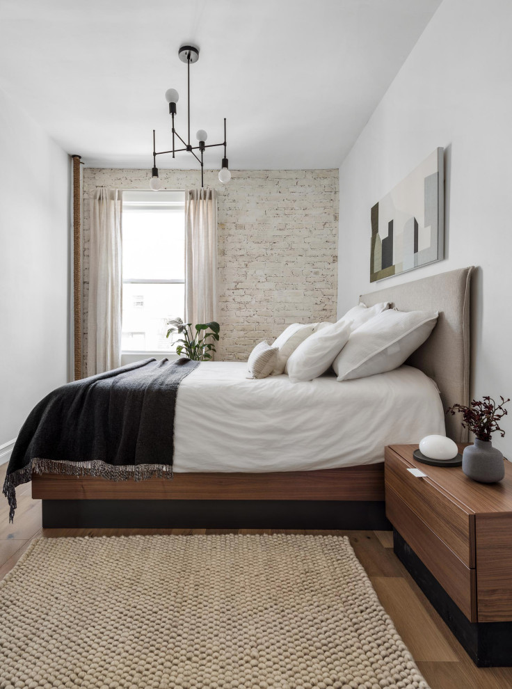 This is an example of a contemporary bedroom in New York.