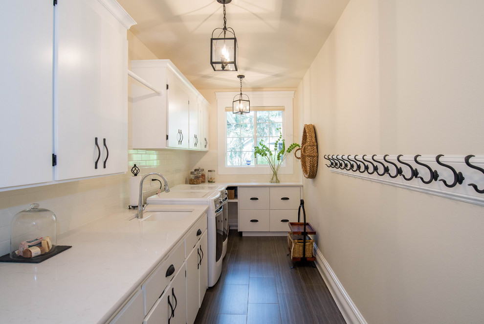 Inspiration for a country laundry room in Seattle with white cabinets and a side-by-side washer and dryer.