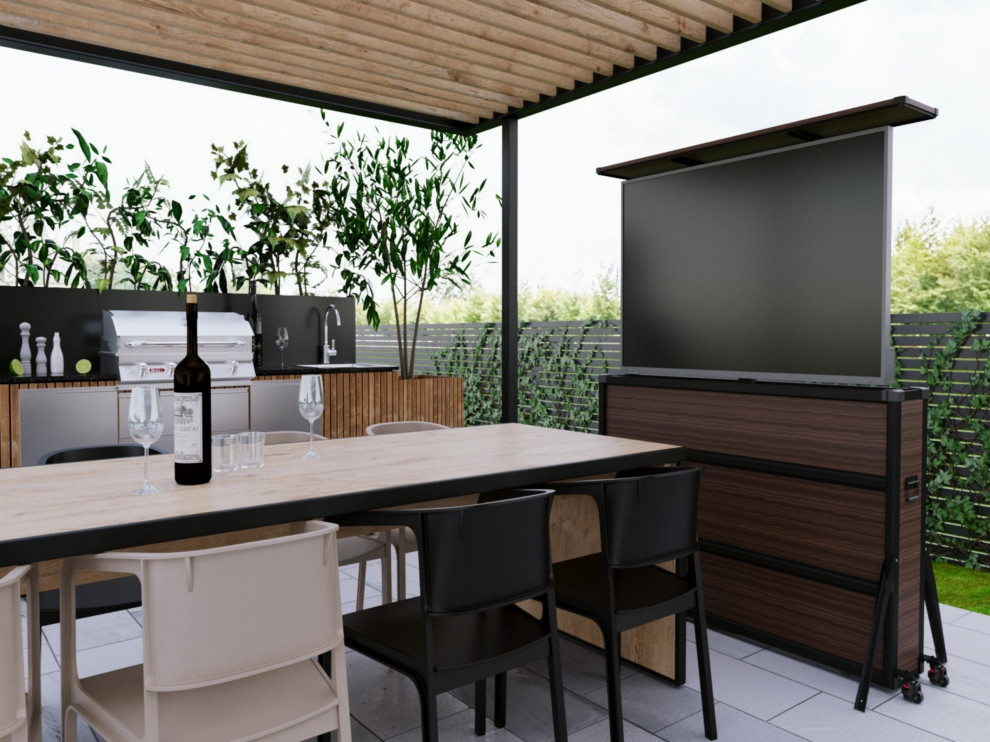 LOutdoor kitchen patio with hidden TV lift cabinet