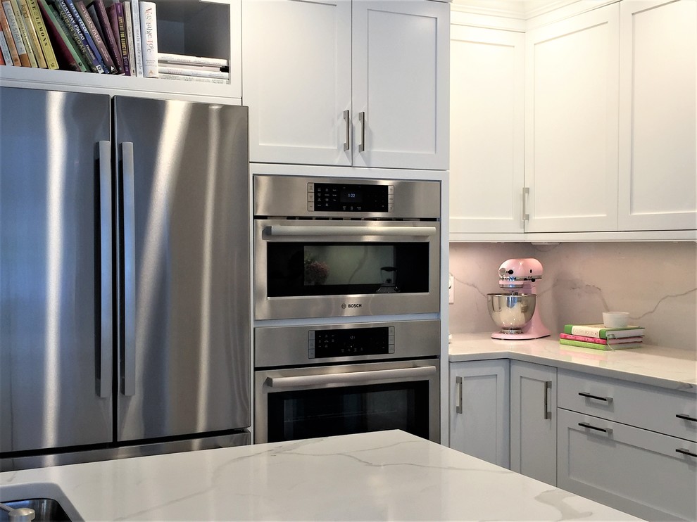 Example of a transitional kitchen design in New York