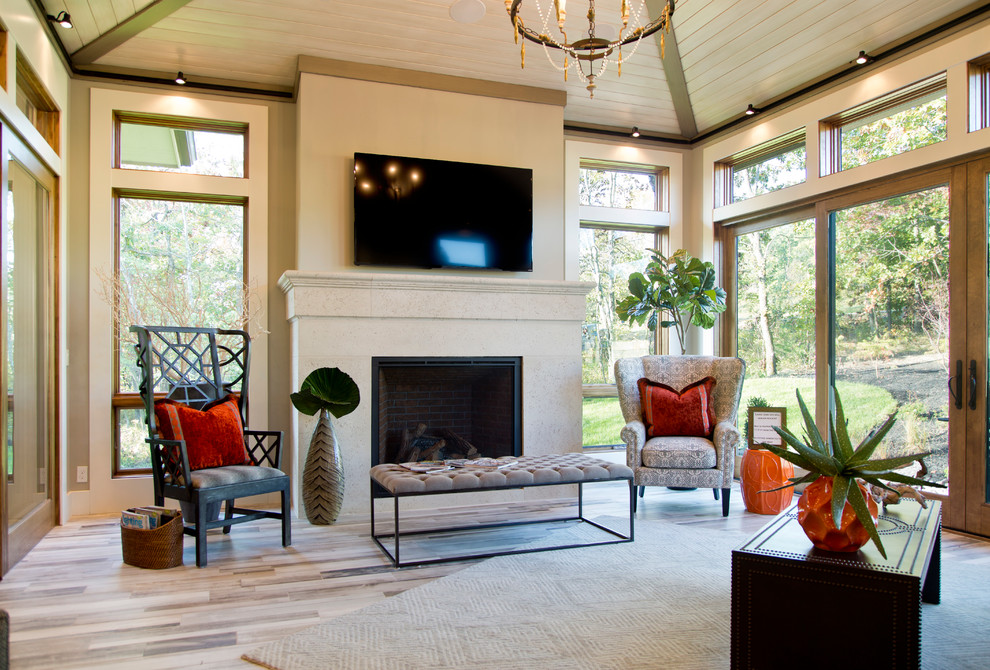 Inspiration for a mid-sized transitional sunroom in Kansas City with light hardwood floors, a standard fireplace, a tile fireplace surround and a standard ceiling.