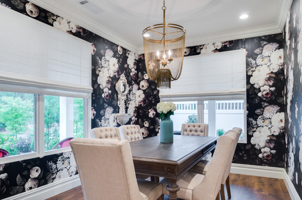 Example of a mid-sized transitional medium tone wood floor and brown floor enclosed dining room design in Orange County with multicolored walls and no fireplace