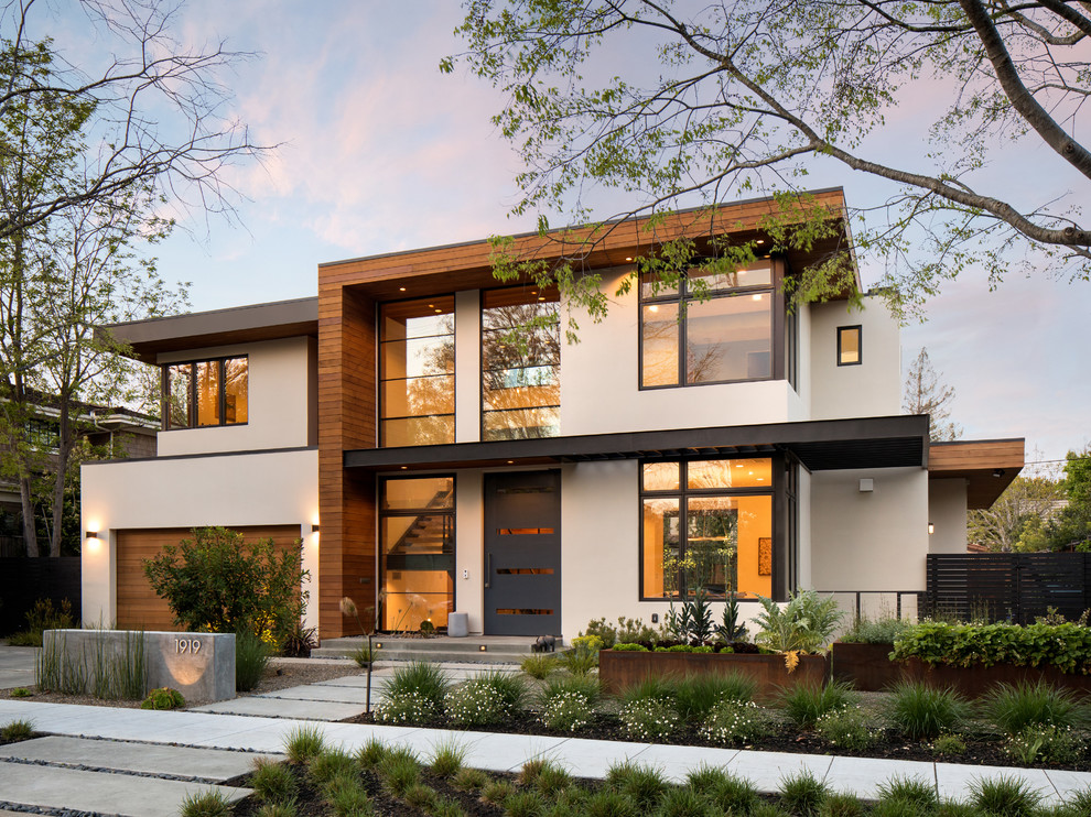 Inspiration for a contemporary two-storey house exterior in San Francisco with mixed siding and a flat roof.