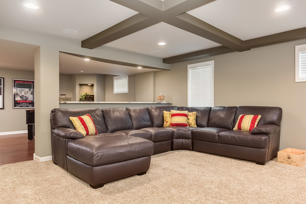 Inspiration for a large transitional look-out basement in Chicago with grey walls, carpet, a standard fireplace, a stone fireplace surround and beige floor.
