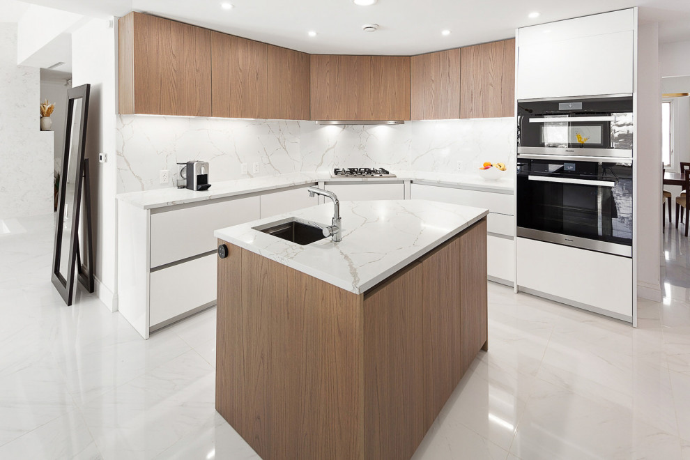 This is an example of a large contemporary u-shaped kitchen/diner in New York with a submerged sink, flat-panel cabinets, medium wood cabinets, engineered stone countertops, white splashback, engineered quartz splashback, stainless steel appliances, porcelain flooring, multiple islands, white floors and white worktops.