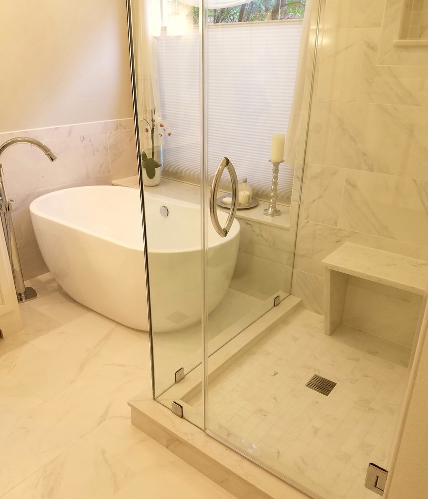 This is an example of a large traditional master bathroom in Austin with raised-panel cabinets, white cabinets, a freestanding tub, an open shower, a two-piece toilet, gray tile, porcelain tile, grey walls, porcelain floors, an undermount sink, quartzite benchtops, white floor and a hinged shower door.