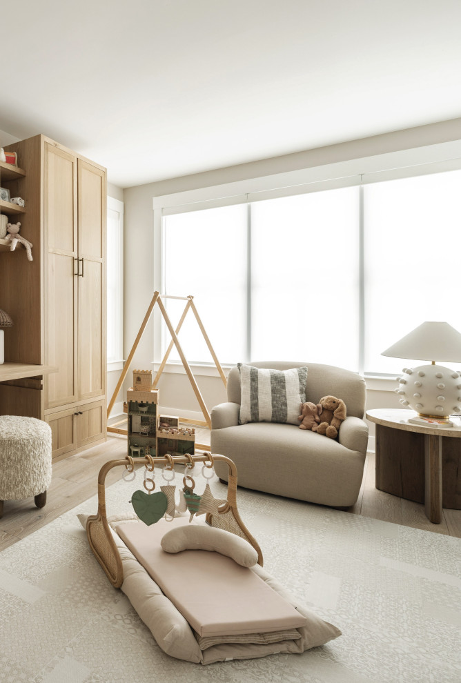Nursery - mid-sized transitional gender-neutral light wood floor and beige floor nursery idea in Philadelphia with white walls