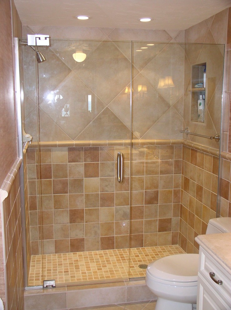 Alcove shower - transitional 3/4 beige tile and ceramic tile ceramic tile and beige floor alcove shower idea with beige walls and a hinged shower door