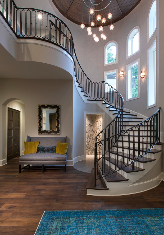 Design ideas for a large contemporary foyer in Jacksonville with grey walls and dark hardwood floors.