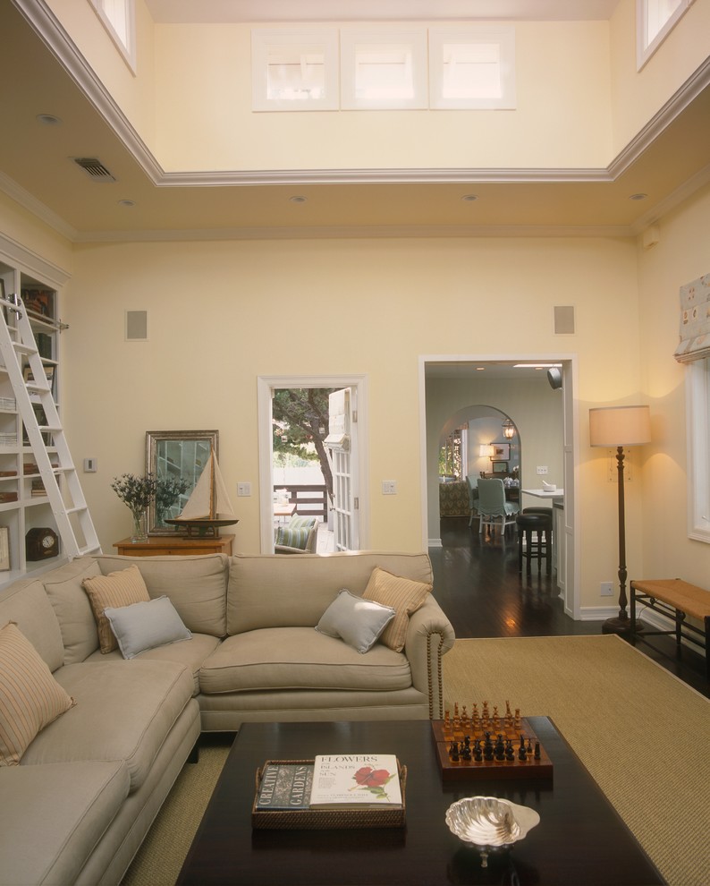 Design ideas for a traditional family room in Los Angeles with yellow walls.