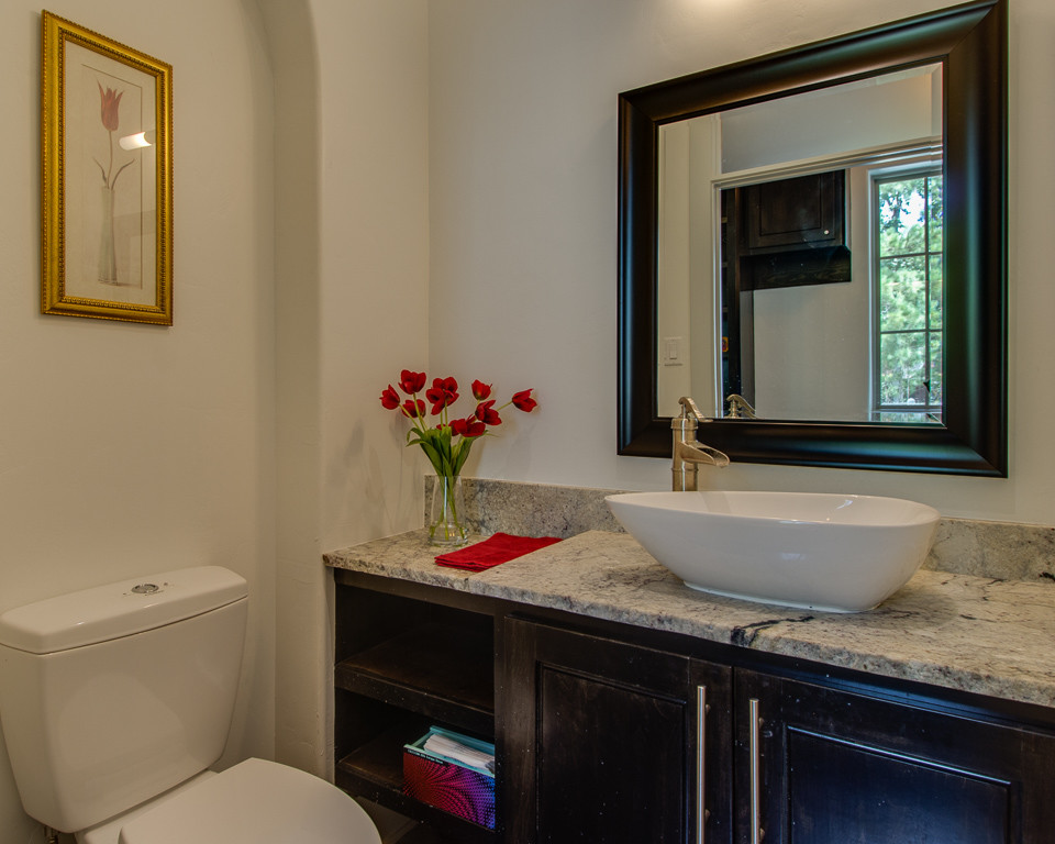Inspiration for a country 3/4 bathroom in Houston with flat-panel cabinets, blue cabinets, a drop-in tub, an alcove shower, black and white tile, ceramic tile, white walls, ceramic floors, a vessel sink and granite benchtops.