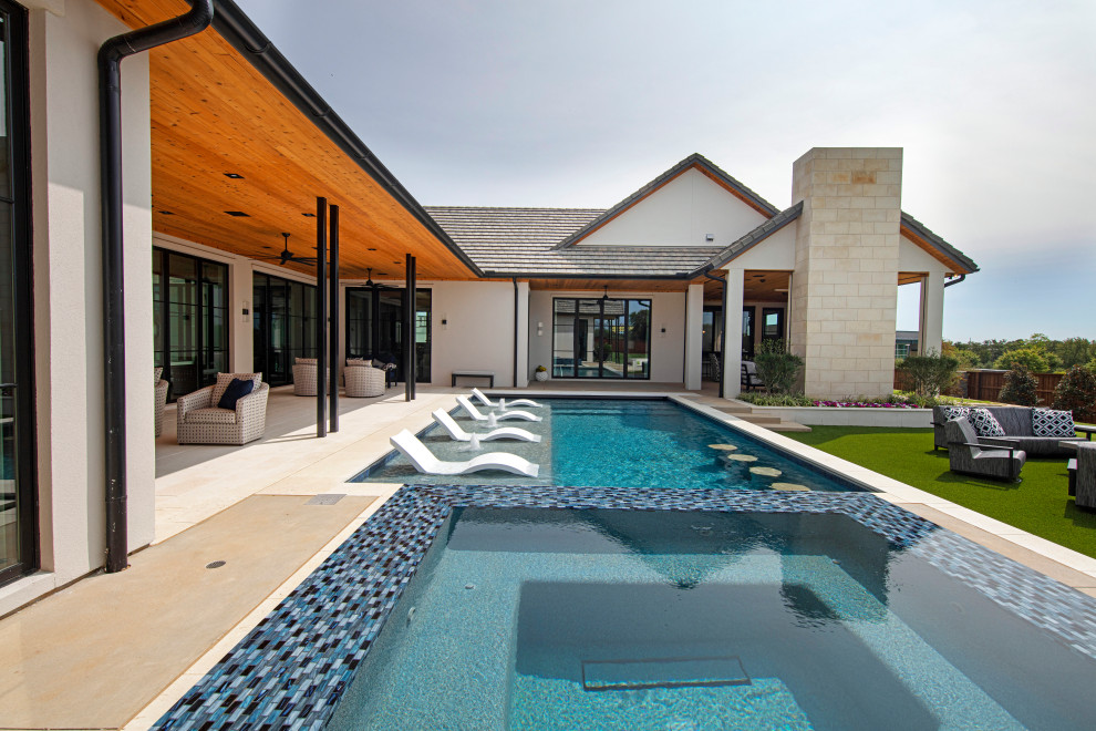 Design ideas for a contemporary pool in Dallas.