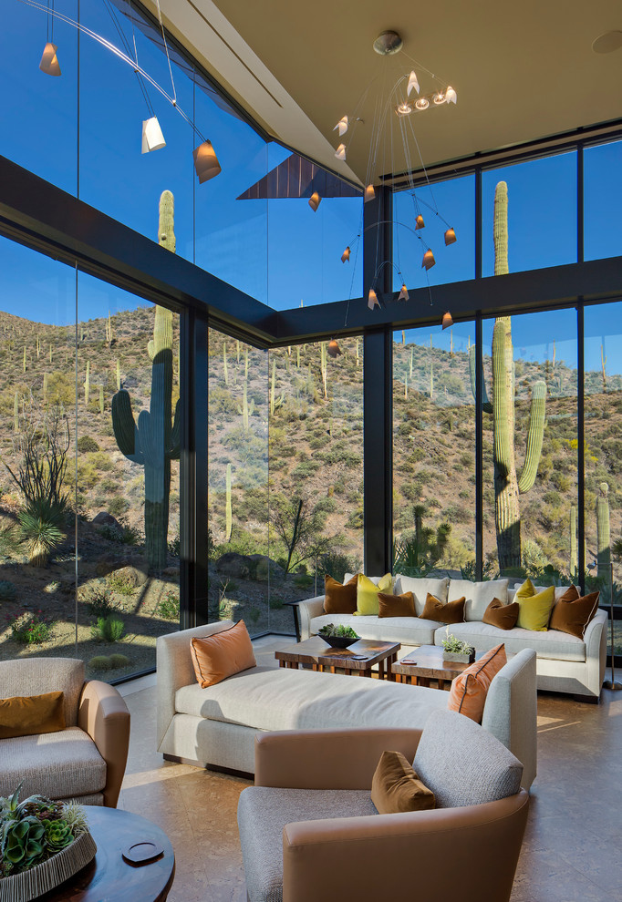 This is an example of a contemporary open concept living room in Phoenix.