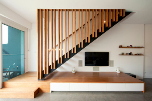 Inspiration for a mid-sized contemporary wood straight staircase in Melbourne with open risers.