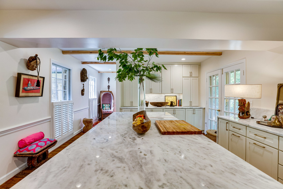 This is an example of a mid-sized transitional u-shaped kitchen in DC Metro with an undermount sink, recessed-panel cabinets, marble benchtops, stainless steel appliances and with island.