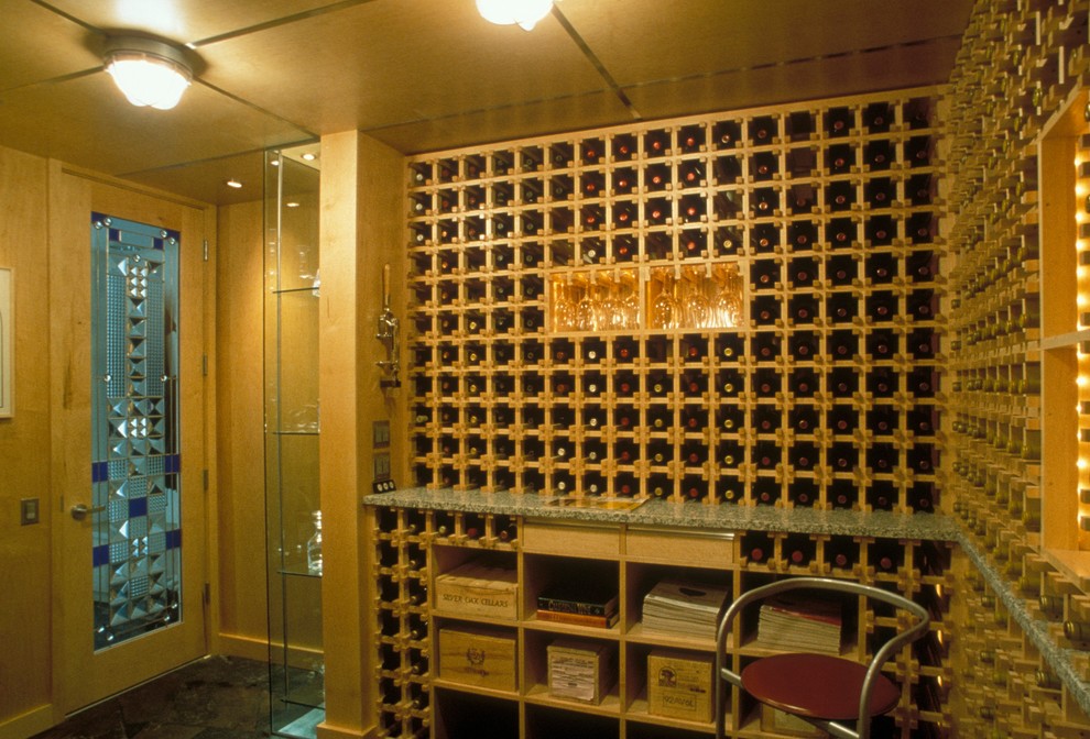Design ideas for a mid-sized contemporary wine cellar in Other with slate floors and storage racks.