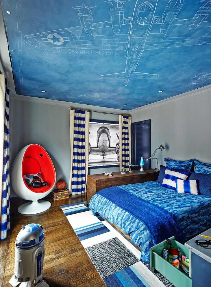 This is an example of a contemporary kids' bedroom for boys in San Francisco with grey walls, dark hardwood floors and brown floor.