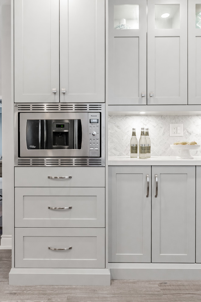Example of a transitional kitchen design in Toronto