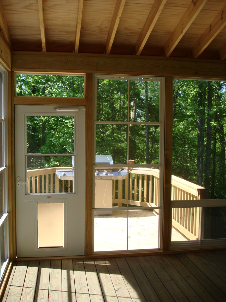 3 Season Room With Eze Breeze Windows Leading To Wood Deck