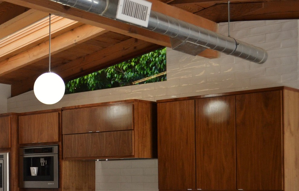 This is an example of a mid-sized midcentury kitchen in Los Angeles.