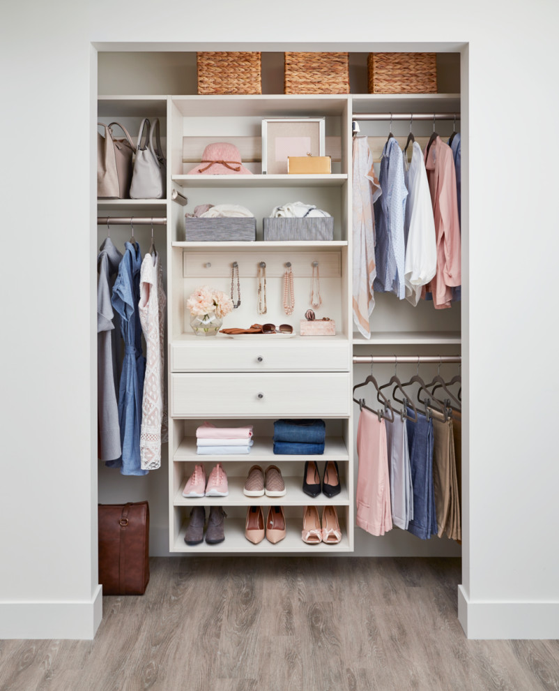 Small trendy gender-neutral closet photo in Burlington