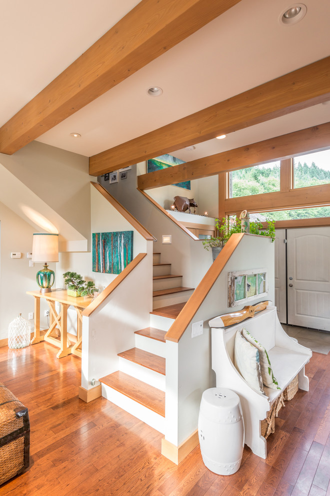 Photo of a country wood l-shaped staircase in Vancouver with painted wood risers.