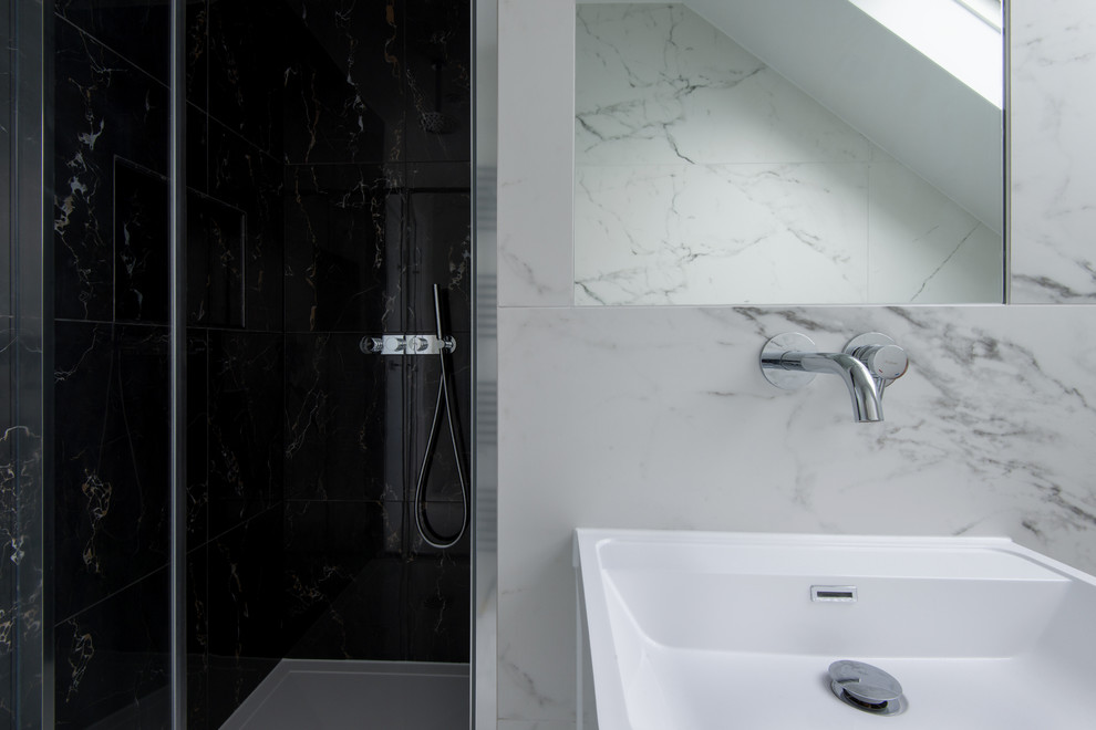 This is an example of a bathroom in London with tile benchtops.