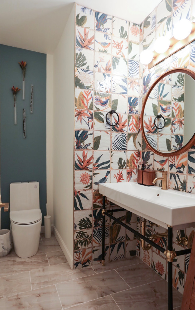 This is an example of a medium sized classic cloakroom in Chicago with white cabinets, a one-piece toilet, multi-coloured tiles, ceramic tiles, multi-coloured walls, porcelain flooring, a console sink, beige floors and a freestanding vanity unit.
