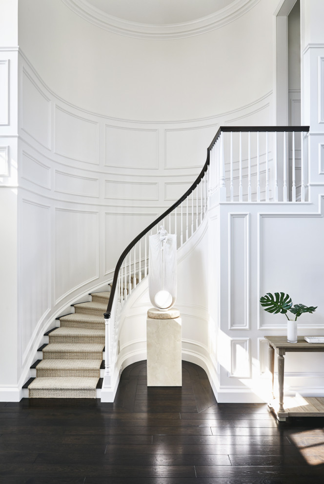 Inspiration for a mid-sized traditional wood curved staircase in San Francisco with wood railing and painted wood risers.