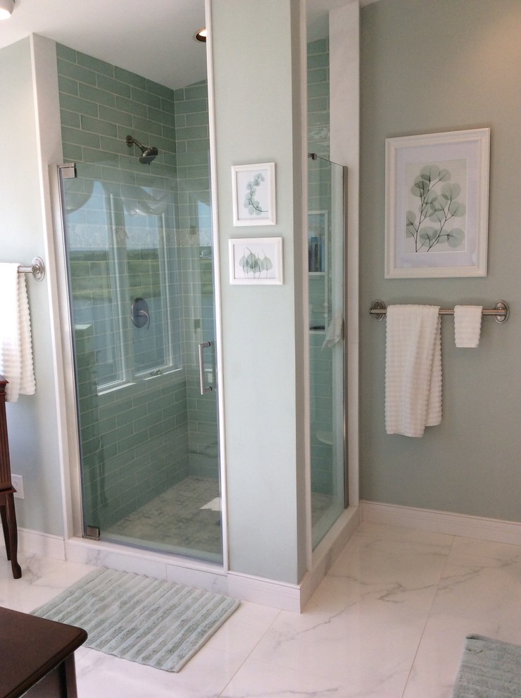 Photo of a large beach style master bathroom in Philadelphia with shaker cabinets, dark wood cabinets, a corner shower, a two-piece toilet, green tile, porcelain tile, white walls, marble floors, an integrated sink, engineered quartz benchtops, white floor and a hinged shower door.