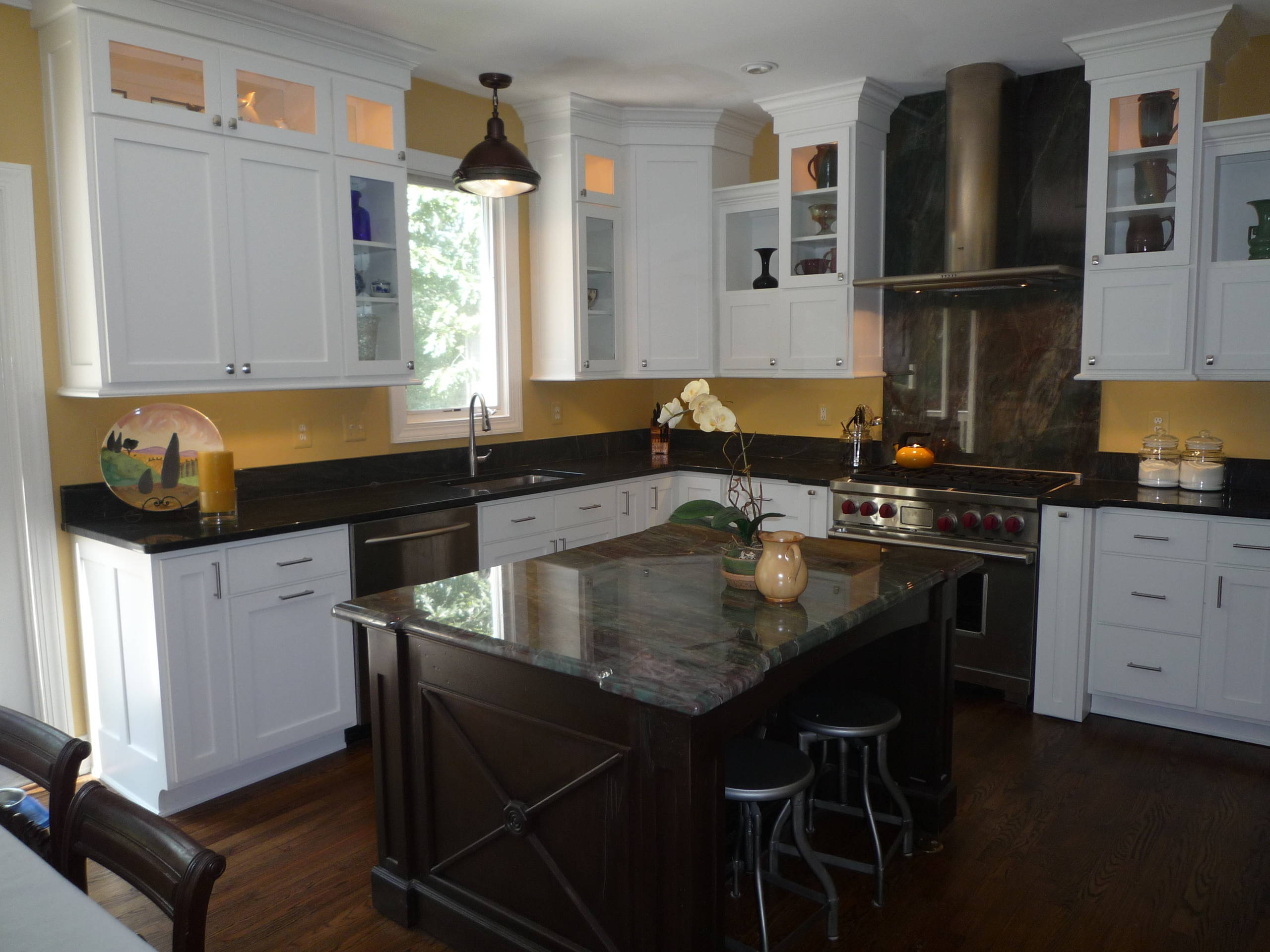 Yellow Kitchen with Green Fire Granite and White Cabinets