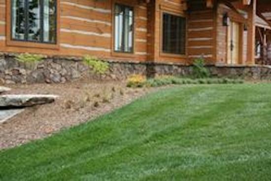 This is an example of a mid-sized partial sun hillside mulch landscaping.