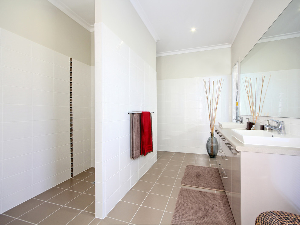 Design ideas for a mid-sized modern master bathroom in Brisbane with a drop-in sink, white tile, ceramic tile, white walls and ceramic floors.