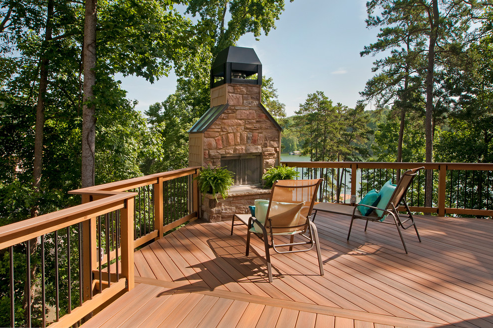 Photo of a country deck in Atlanta with with fireplace and no cover.