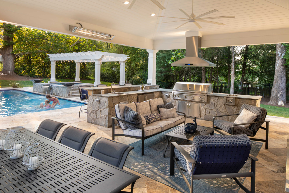 Transitional backyard stone patio photo in DC Metro