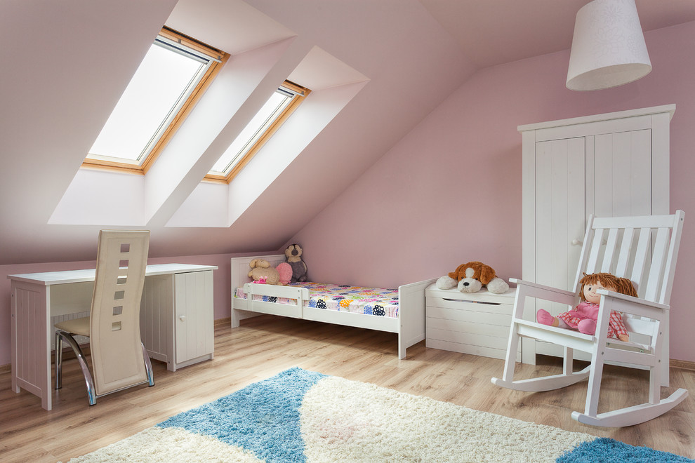 Inspiration for a contemporary kids' room for girls in Chicago with pink walls and light hardwood floors.