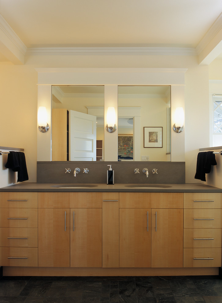 Design ideas for a mid-sized transitional master bathroom in Seattle with an undermount sink, flat-panel cabinets, light wood cabinets, limestone benchtops, a corner shower, a one-piece toilet, beige walls and slate floors.
