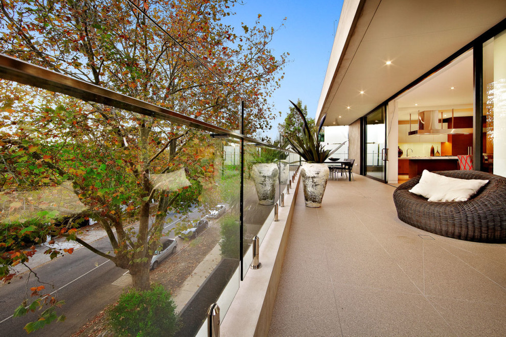 Photo of an expansive contemporary patio in Melbourne with tile.