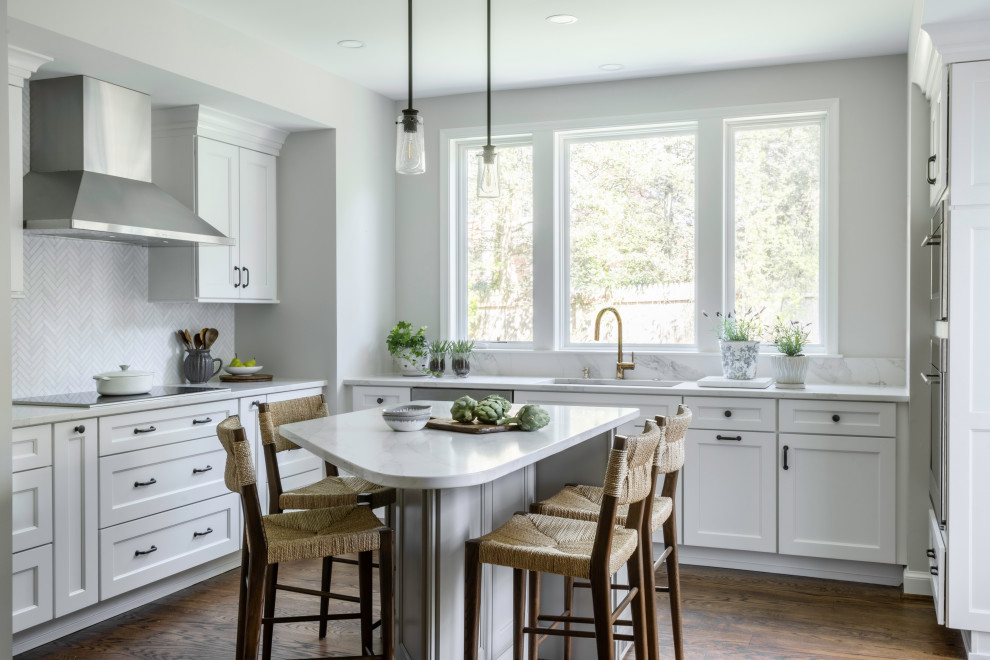 Inspiration for a transitional medium tone wood floor and brown floor kitchen remodel in DC Metro with stainless steel appliances