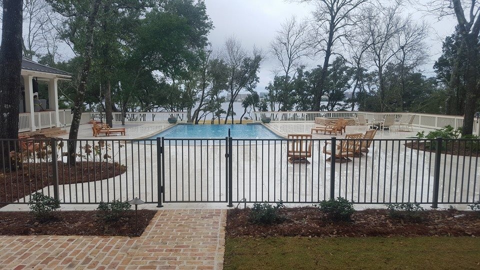 Inspiration for a mid-sized transitional backyard concrete paver and rectangular infinity pool fountain remodel in Miami