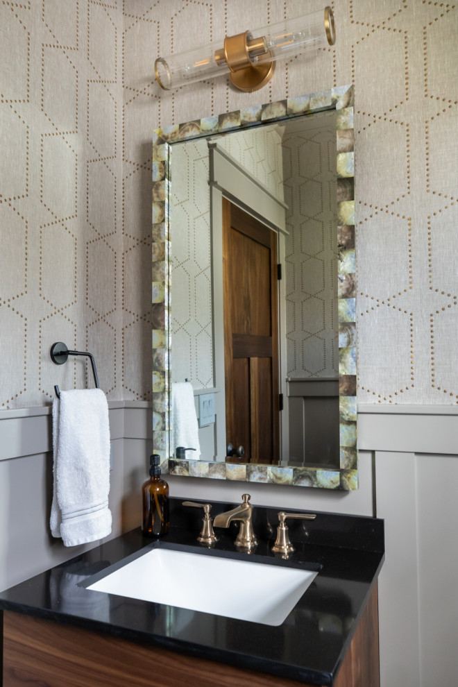 Inspiration for an eclectic cloakroom in Chicago with beige walls, dark hardwood flooring, brown floors and wallpapered walls.