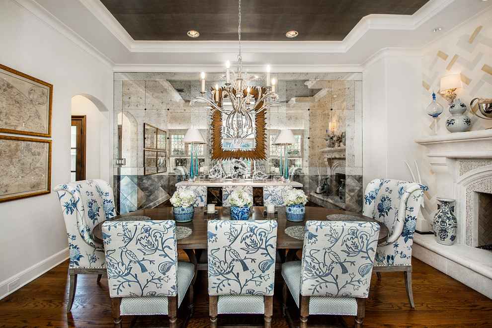 Large elegant dark wood floor enclosed dining room photo in Dallas with white walls and a standard fireplace