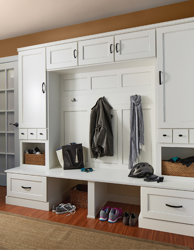 Inspiration for a mid-sized traditional mudroom in Orange County with brown walls and medium hardwood floors.