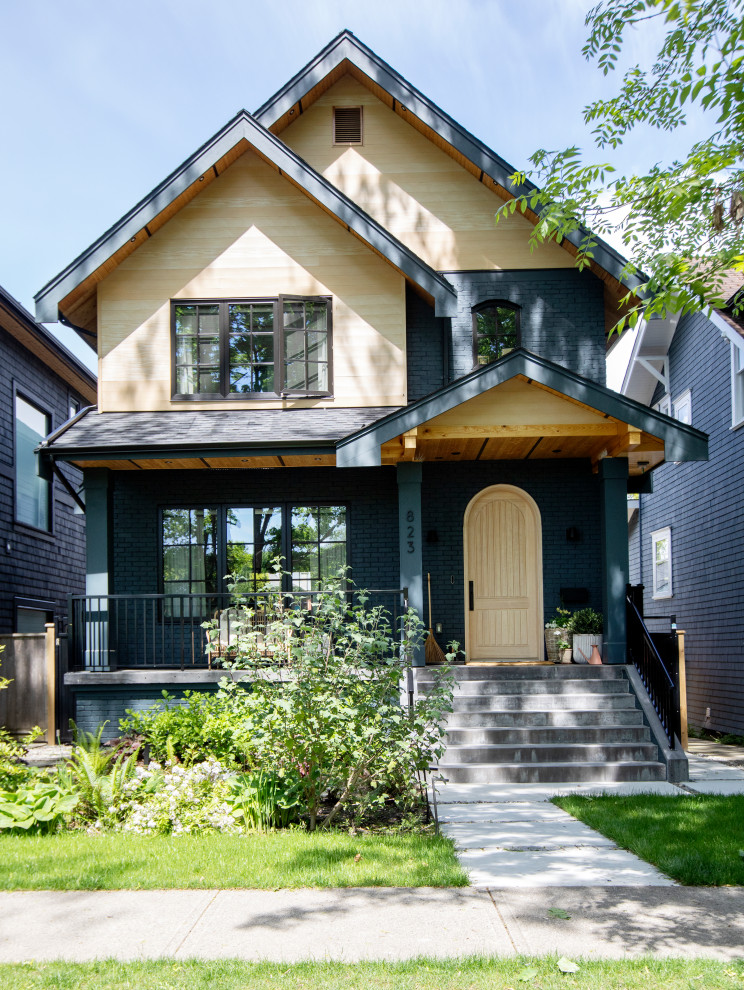 Mid-sized transitional three-storey green exterior in Vancouver.